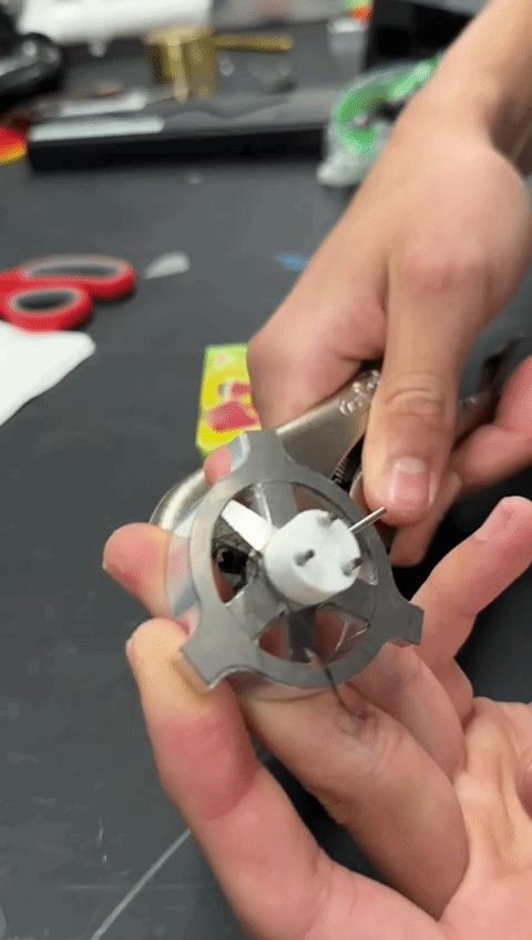 Version 6 metal rotor assembly held in hands